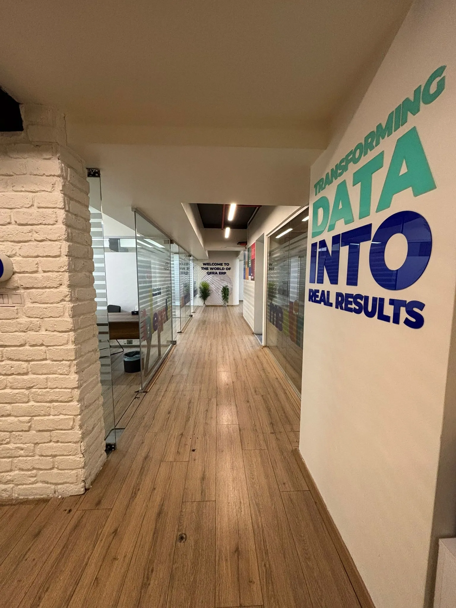Qera office corridor — Transforming Data Into Real Results